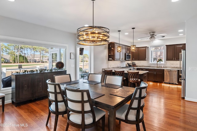 dining space featuring recessed lighting, a healthy amount of sunlight, and wood finished floors