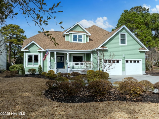 view of front facade with a porch, a shingled roof, and concrete driveway