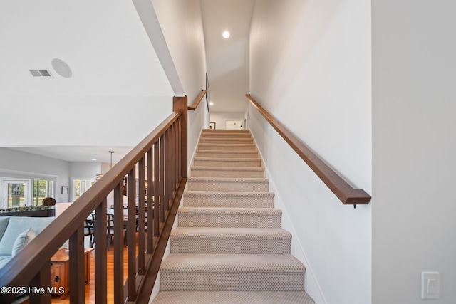 stairs featuring recessed lighting, visible vents, and baseboards