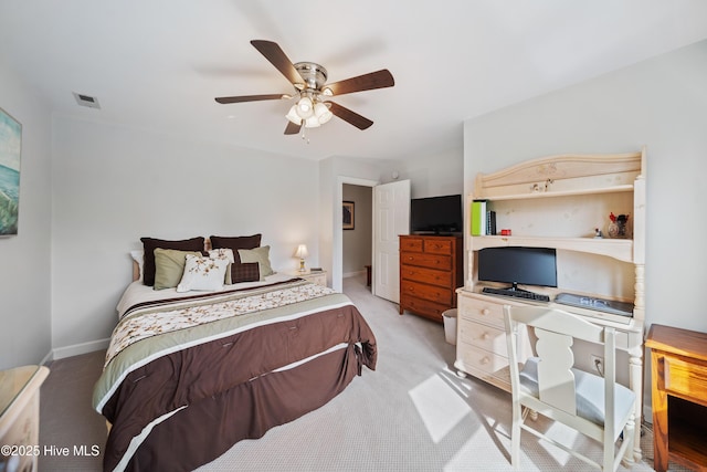 bedroom featuring light colored carpet, baseboards, and ceiling fan