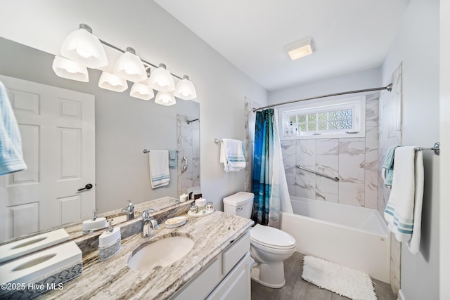 bathroom featuring vanity, toilet, shower / tub combo, and wood finished floors