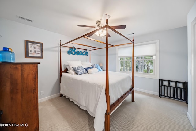 bedroom with carpet, visible vents, and baseboards