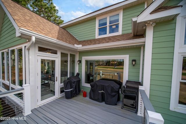 wooden terrace with area for grilling