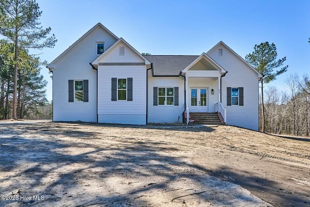 view of front of house with french doors and brick siding