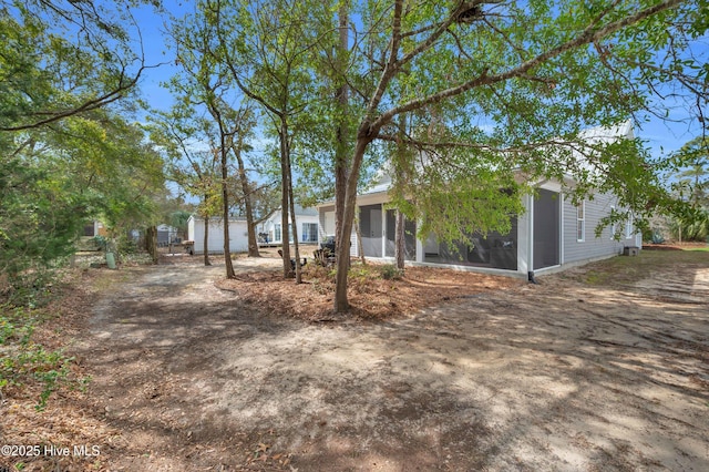 view of front of house with a sunroom