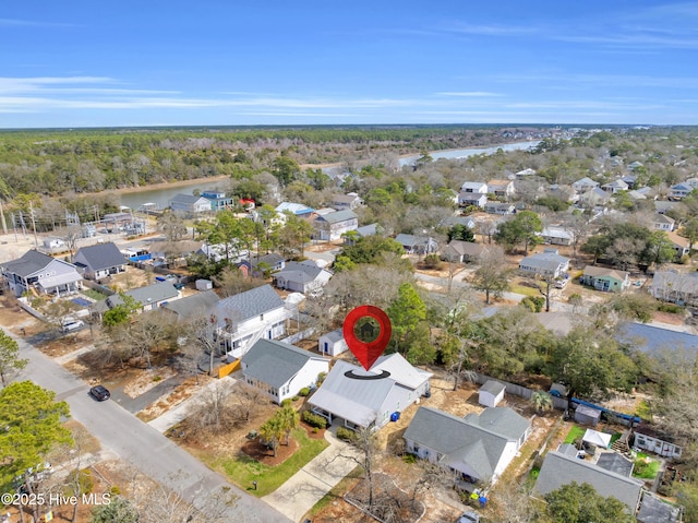 drone / aerial view with a residential view and a water view