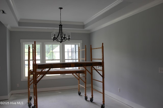 104 Backfield Dr, Newport, NC 28570 - dining room featuring a tray ceiling, a chandelier, ornamental molding, and baseboards