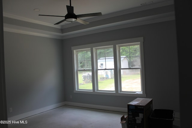 104 Backfield Dr, Newport, NC 28570 - empty room featuring crown molding, concrete flooring, ceiling fan, baseboards, and a raised ceiling