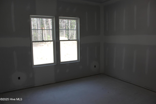 spare room with concrete floors