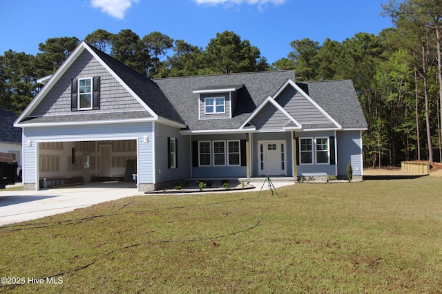 craftsman house with concrete driveway, a front lawn, a shingled roof, and a garage