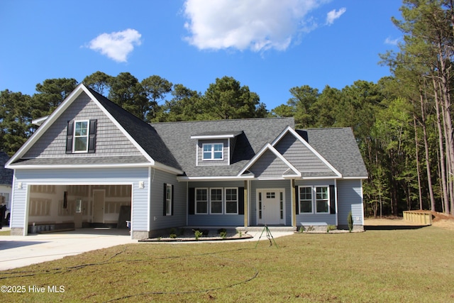 craftsman-style house with driveway, a front lawn, and roof with shingles