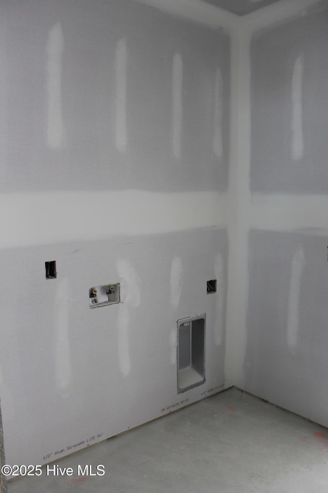 clothes washing area with hookup for a washing machine and laundry area