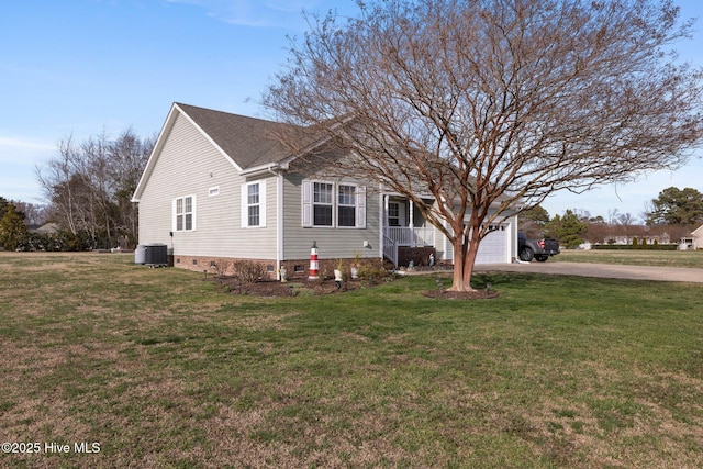 view of front of property featuring a front yard, crawl space, central AC, and driveway