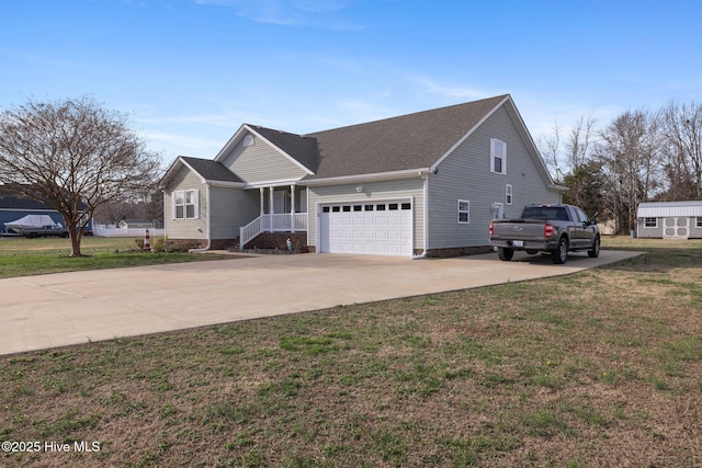 view of front of house featuring a garage, a front lawn, and concrete driveway