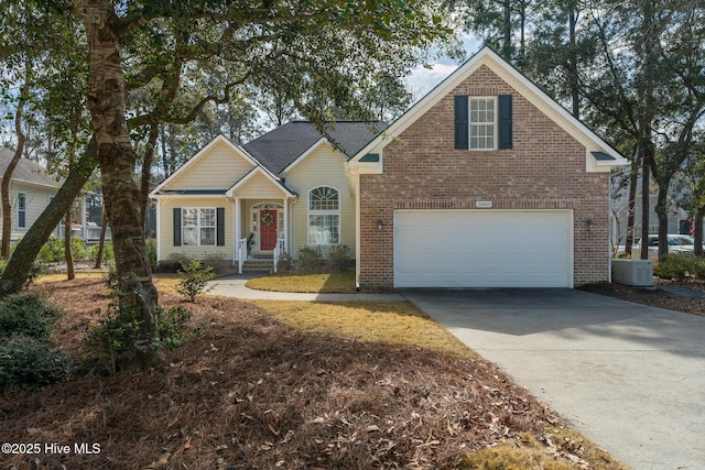 view of front of property featuring a garage, central AC unit, concrete driveway, and brick siding