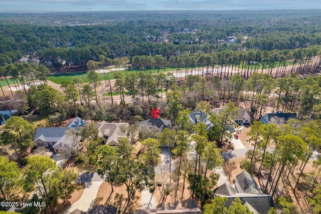 aerial view featuring a wooded view