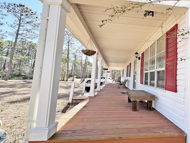 wooden terrace with a porch