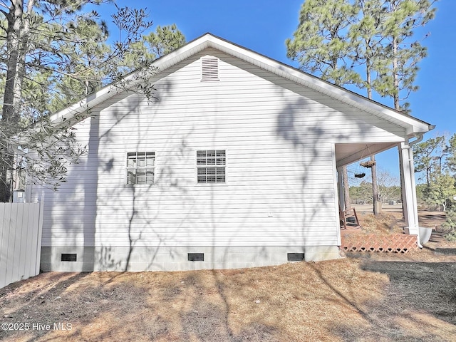 view of side of home with crawl space