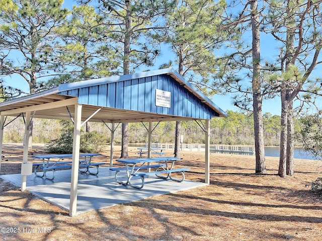 surrounding community featuring a water view and a gazebo