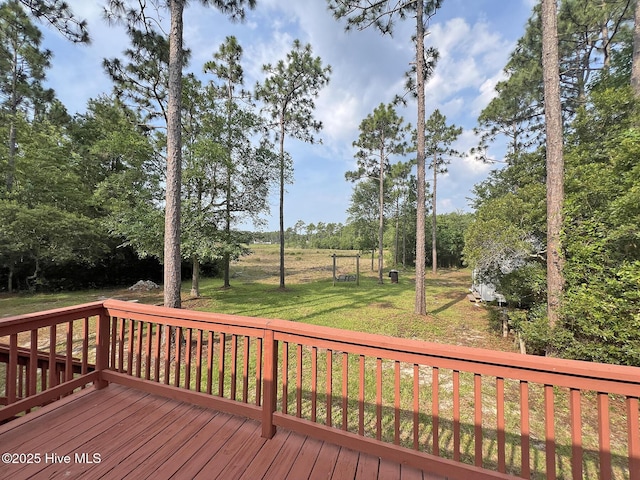141 N Lake Dr, Boiling Spring Lakes, NC 28461 - wooden deck featuring a lawn