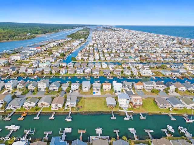 bird's eye view featuring a water view and a residential view