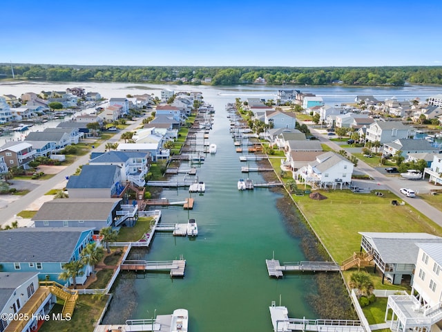 drone / aerial view with a residential view and a water view