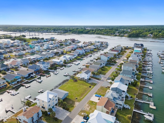 drone / aerial view featuring a residential view and a water view