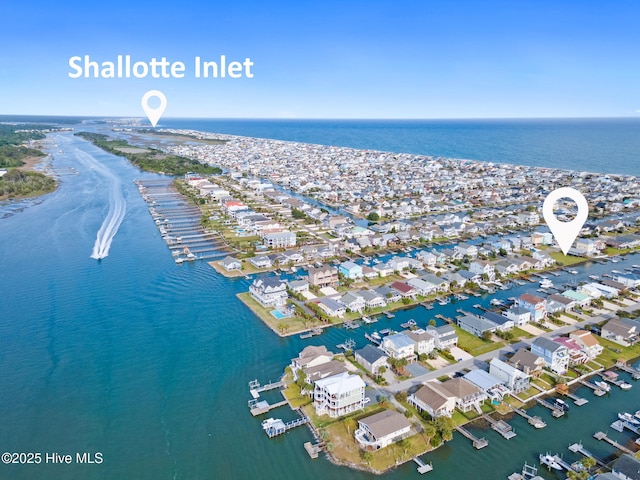 drone / aerial view featuring a water view and a residential view