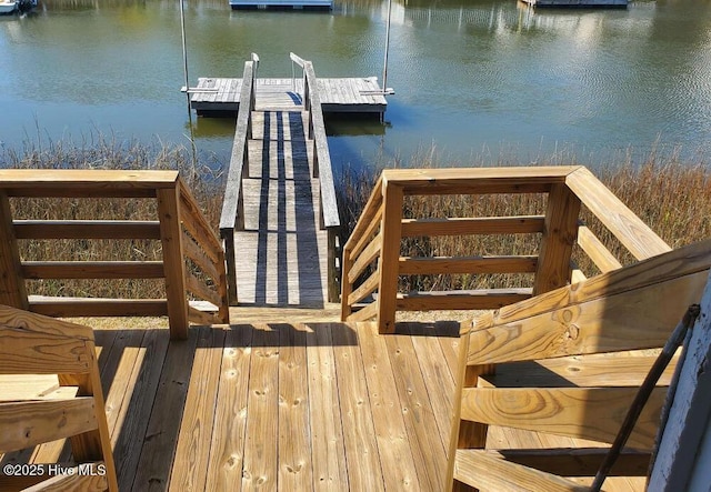 dock area with a water view