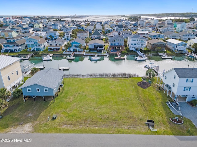 aerial view with a residential view and a water view