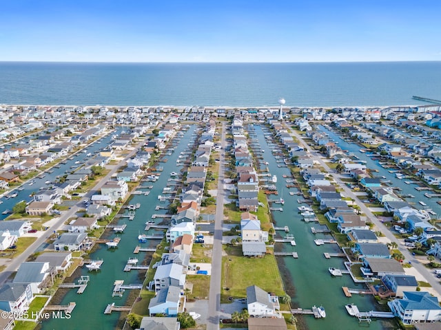 birds eye view of property with a water view and a residential view