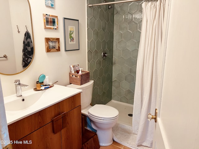 full bath with vanity, a shower stall, toilet, and tile patterned floors