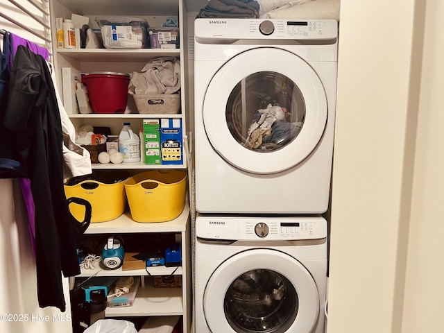 laundry room featuring laundry area and stacked washer and clothes dryer