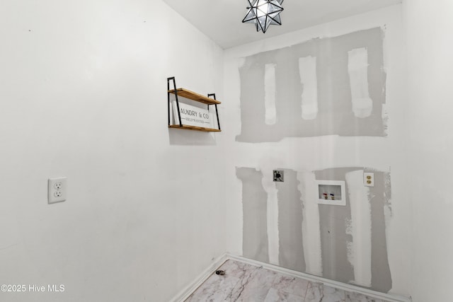 washroom featuring baseboards, marble finish floor, hookup for a washing machine, and laundry area