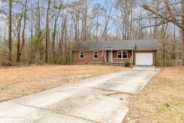 ranch-style house with driveway, a porch, an attached garage, crawl space, and brick siding