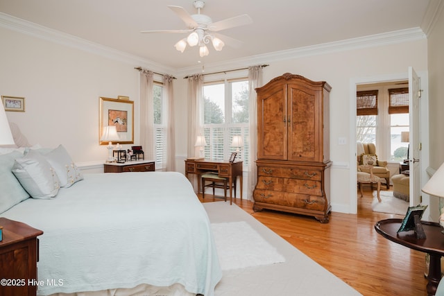 bedroom with ornamental molding and light wood-type flooring