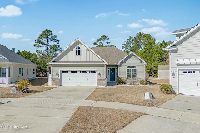 craftsman inspired home featuring an attached garage, stone siding, board and batten siding, and concrete driveway