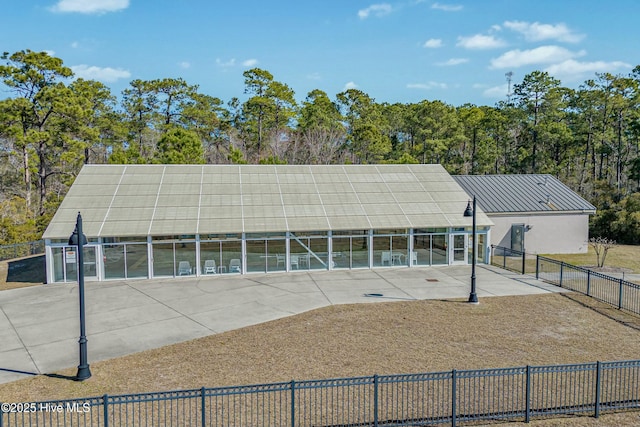 view of home's community with fence