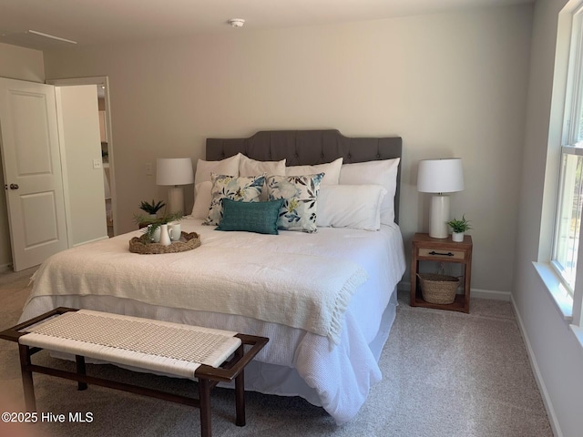 carpeted bedroom with baseboards