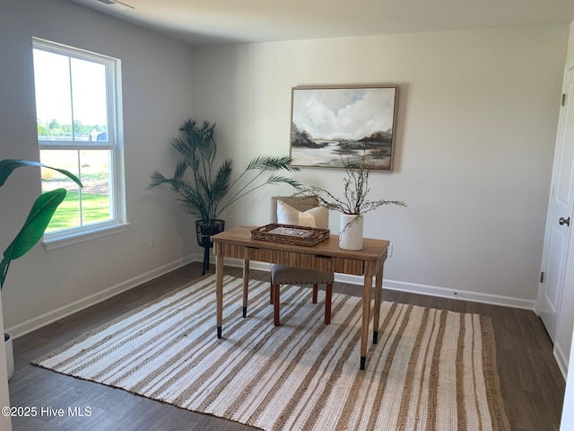 home office with dark wood-style floors and baseboards