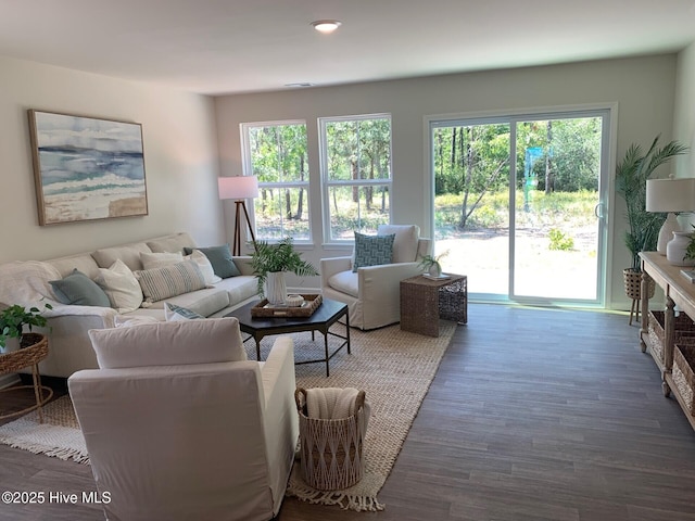 living area with visible vents, dark wood finished floors, and recessed lighting