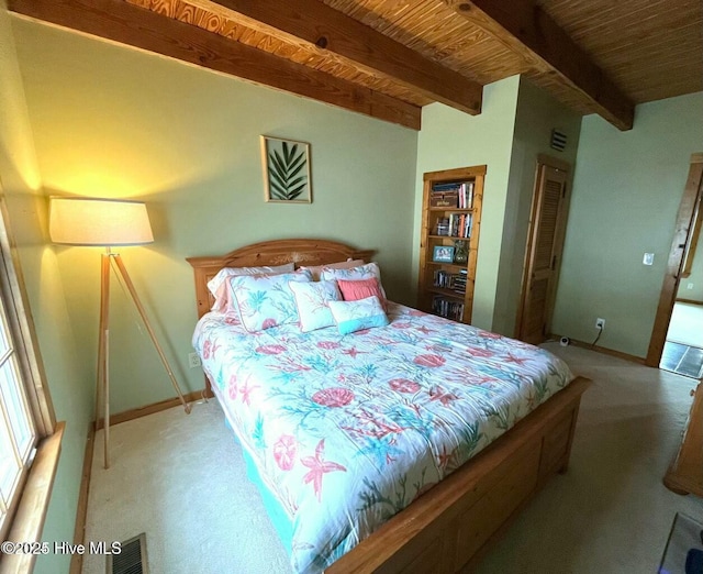 bedroom featuring light carpet, wooden ceiling, baseboards, and beam ceiling