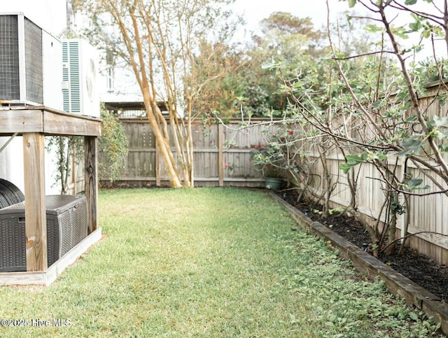 view of yard featuring a fenced backyard and cooling unit