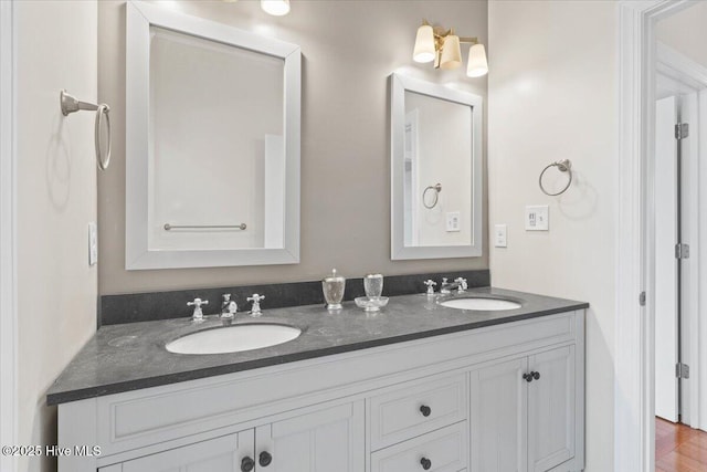 bathroom with double vanity and a sink