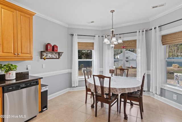 dining room featuring light tile patterned floors, visible vents, ornamental molding, and baseboards