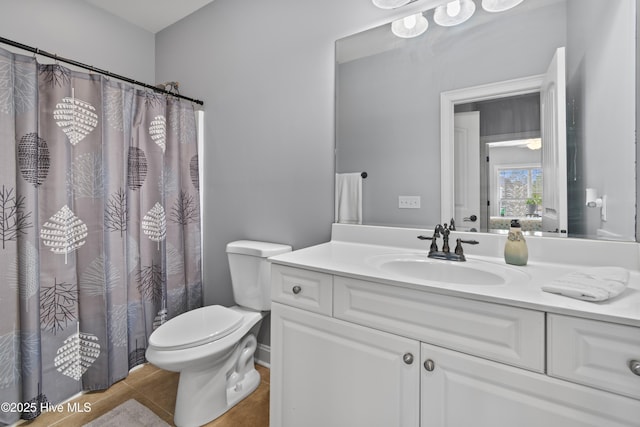 full bath featuring tile patterned flooring, vanity, and toilet