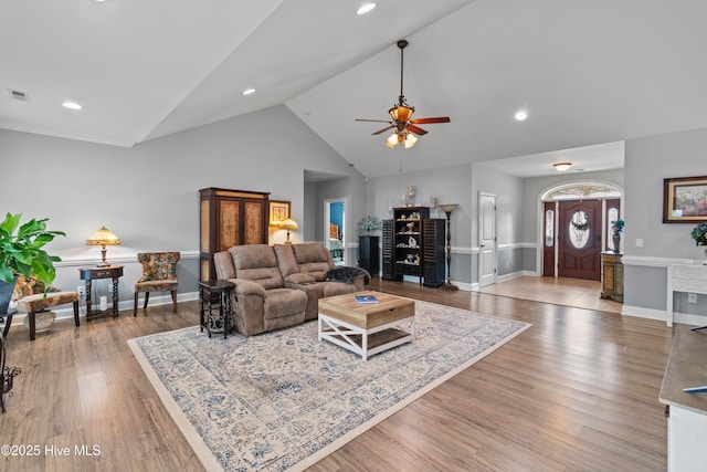 living area featuring light wood-type flooring, visible vents, baseboards, and recessed lighting