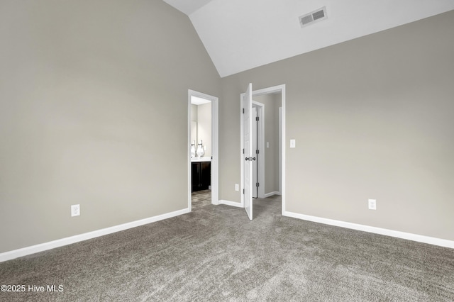 unfurnished bedroom with carpet floors, high vaulted ceiling, baseboards, and visible vents