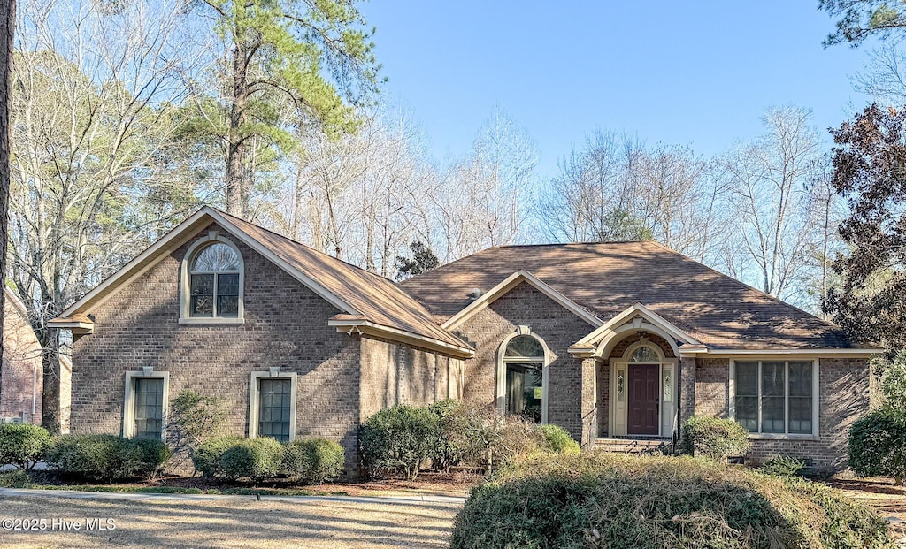 view of front of house with brick siding