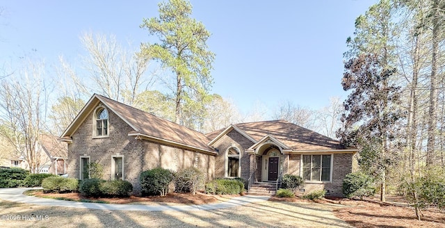 view of front of home featuring brick siding